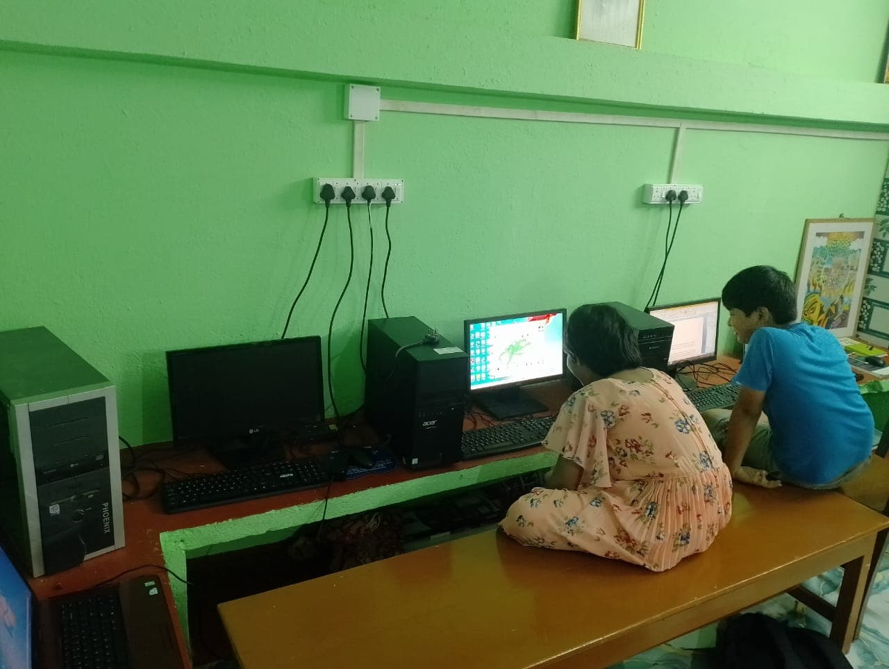 Students exploring hardware components of a computer